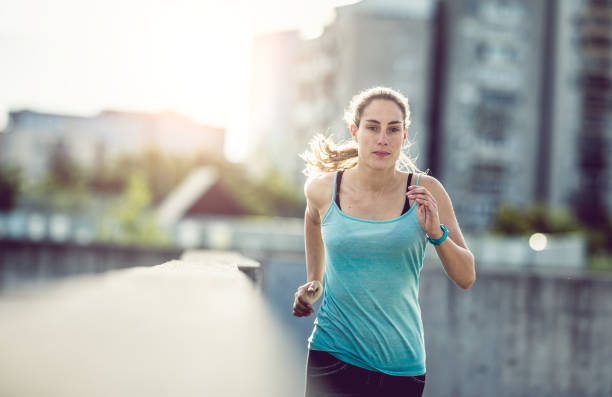 istock Female Athlete Running Outdoors 697288408