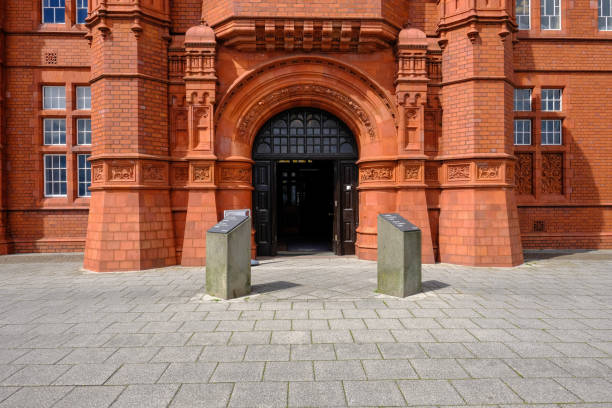 Cardiff Bay, Wales - May 20, 2017: Pierhead building entrance. Pierhead building with majestic entrance.  Landscape shot shows the lovely red brick work of this magnificent building in Cardiff Bay. national assembly for wales stock pictures, royalty-free photos & images