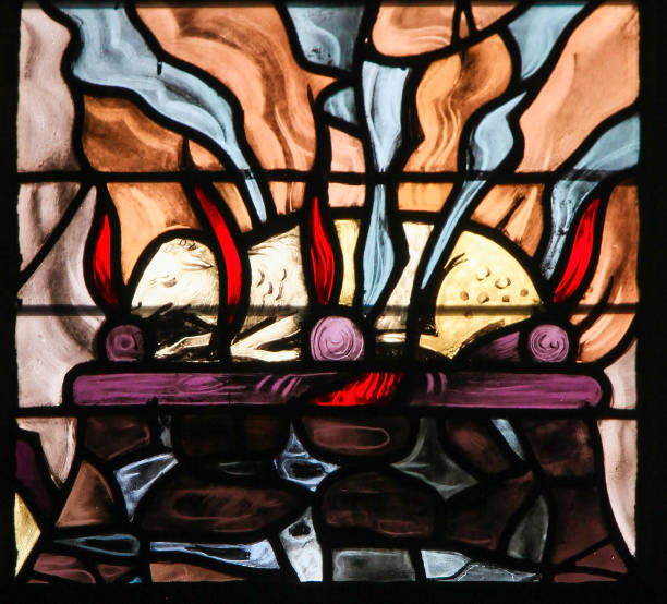 Stained Glass of a burning lamb, symbolizing the Agnus Dei Stained Glass in the Church of Tervuren, Belgium, depicting a burning lamb, symbolizing the Agnus Dei agnus dei stock pictures, royalty-free photos & images