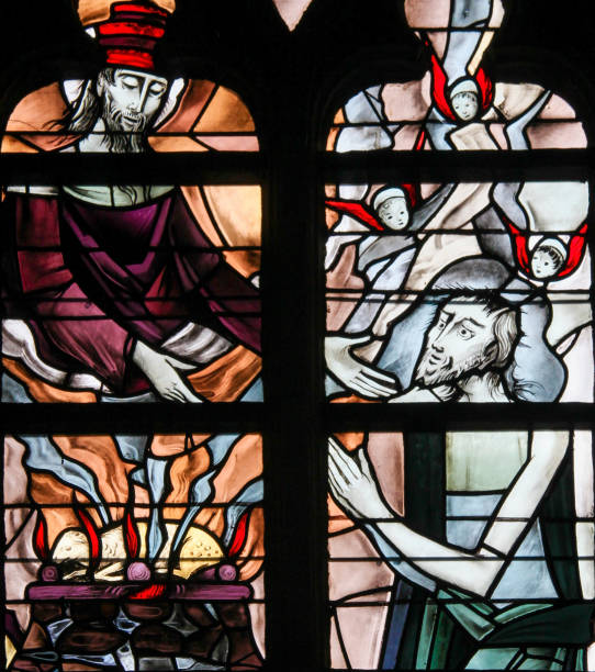 Stained Glass - Jesus Christ Stained Glass in the Church of Tervuren, Belgium, depicting God reaching His Hand towards His Son Jesus Christ and a lamb burning, symbolizing Agnus Dei agnus dei stock pictures, royalty-free photos & images