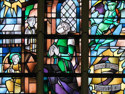 Stained Glass in the Church of Tervuren, Belgium, depicting the Sacrament of Penance or Confession