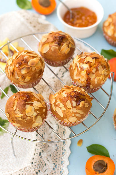 Apricot muffins with sliced almonds and apricots Apricot muffins with sliced almonds and fresh apricots almond slivers stock pictures, royalty-free photos & images