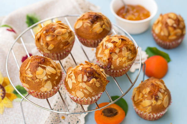 Apricot muffins with sliced almonds and apricots Apricot muffins with sliced almonds and fresh apricots almond slivers stock pictures, royalty-free photos & images