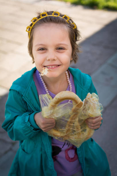 istock Eating pretzel outdoor 697302220
