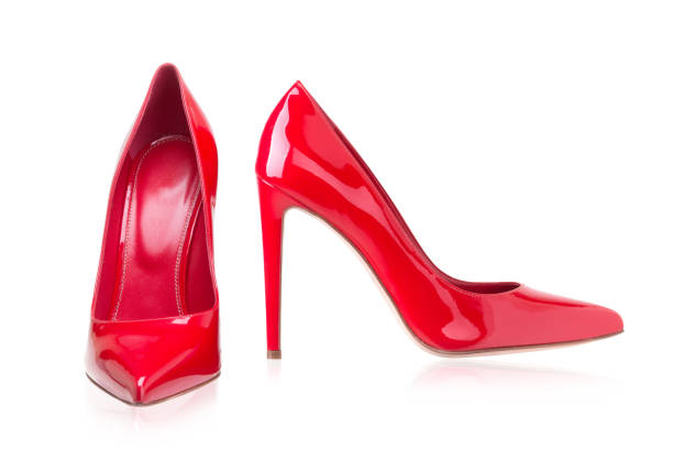 istock Women's red shoes from a varnish on a white background 697302792