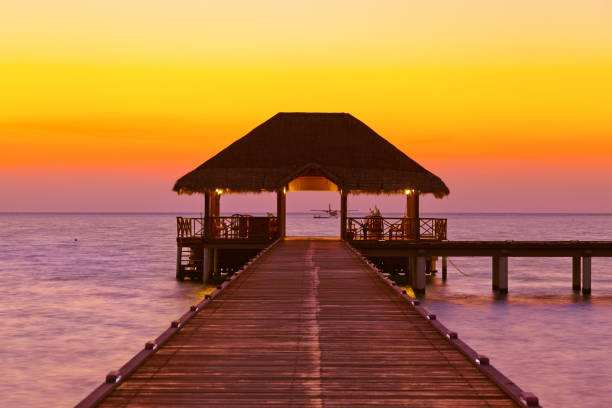 istock Water cafe at sunset - Maldives 697308478