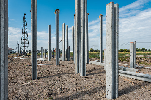 consruction site with  precast concret pile and pile-driver, prefabrication house structure design