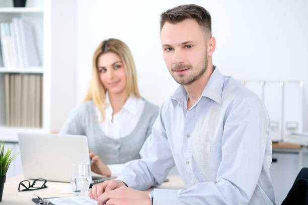 istock Two successful business partners working at meeting in office 697326988