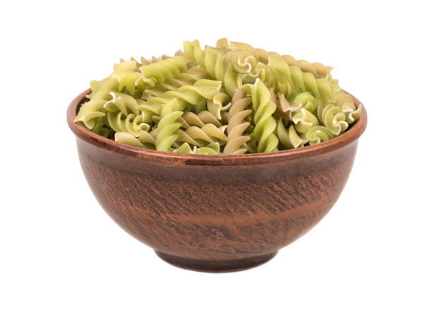 istock Green pasta fusilli in bowl 697328662