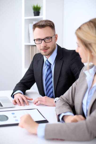 istock Two successful business partners working at meeting in office 697329044