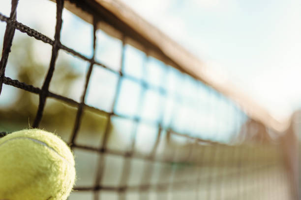 istock Ball in net closeup, big tennis concept 697330282