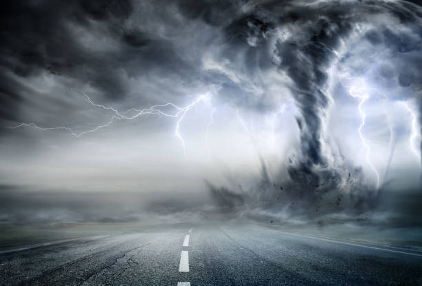 istock Powerful Tornado On Road In Stormy Landscape 697333214