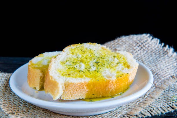 istock Bread slies with olive oil and spices 697336934