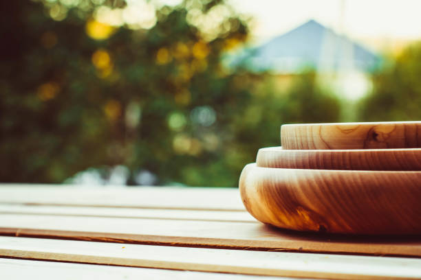 Empty wooden dish on the table in the open air