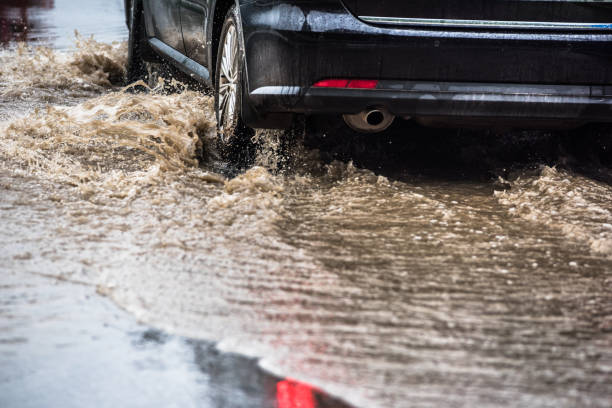 istock dirty water splash after vehicle roaring by 697343892