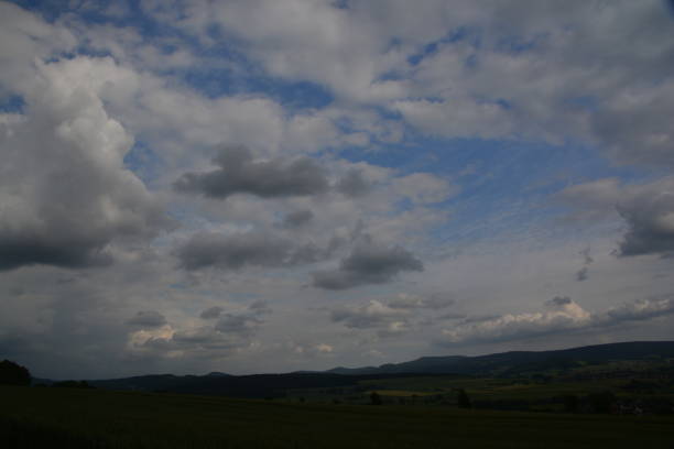 istock Clouds move across the country 697344804