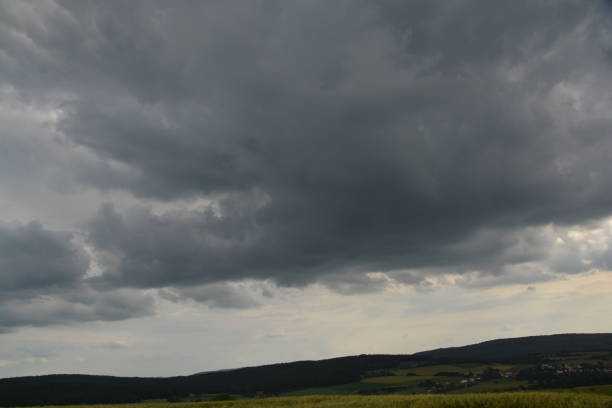 istock Clouds move across the country 697347602