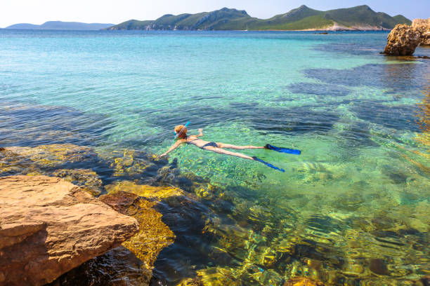istock Woman snorkeling Greece 697354262
