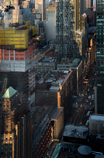 looking north on Eighth Avenue in midtown Manhattan, NYC, in the late afternoon as the sun is setting