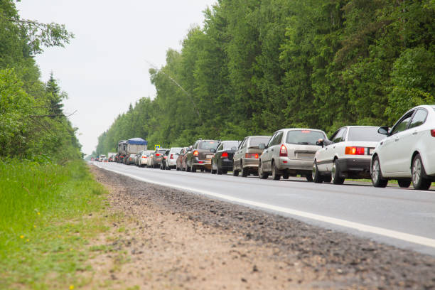 istock Traffic jam on a road throug a forest in Russia 697361898