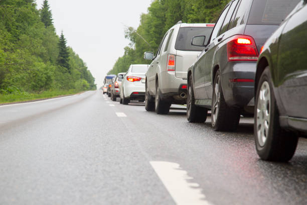 istock Traffic jam on a road throug a forest in Russia 697361944
