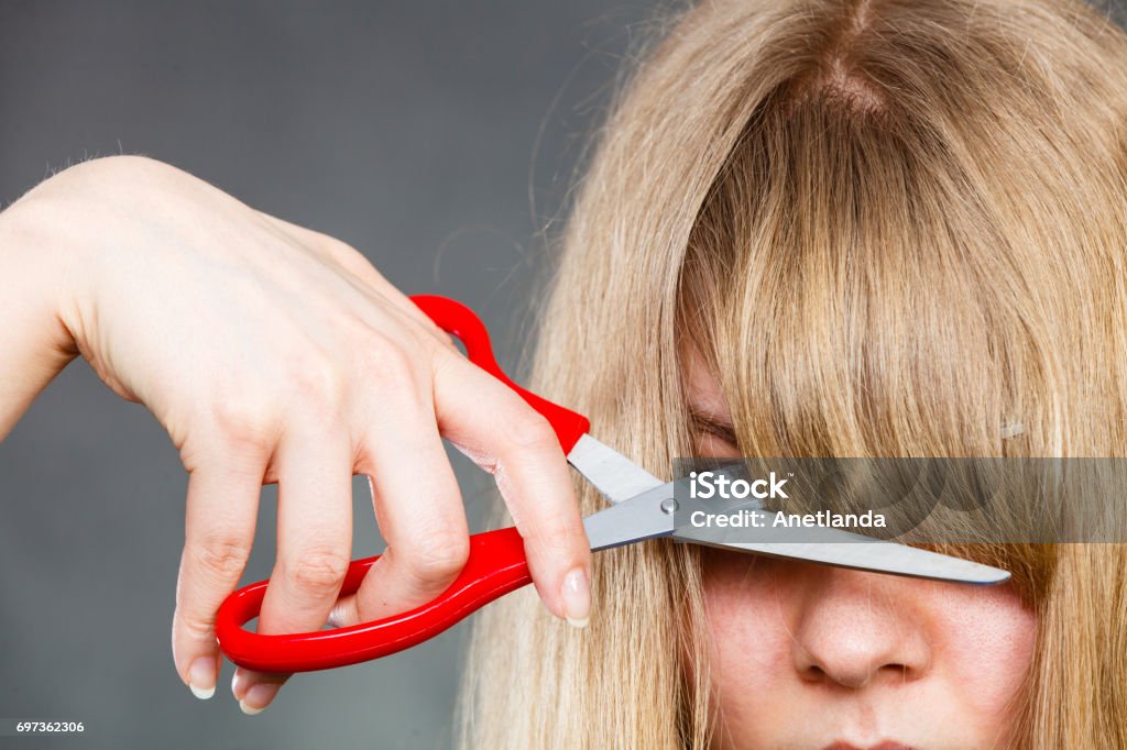 Woman Cutting Her Fringe Stock Photo - Download Image Now - Bangs - Hair,  Cutting, Women - iStock
