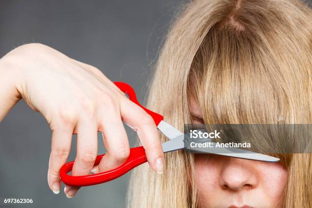 Woman Cutting Her Fringe Stock Photo - Download Image Now - Bangs - Hair,  Cutting, Women - iStock