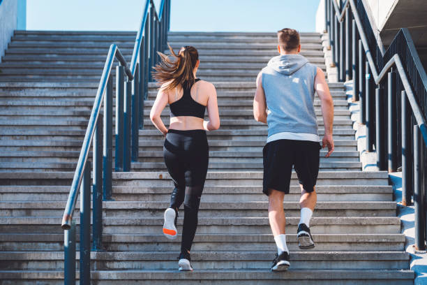 istock Young athletes running up the stairs 697373302