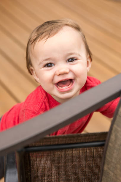 istock Happy Baby Boy Playing Outside on Deck 697375790