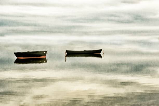 istock Two rowing boats in fog 697383798