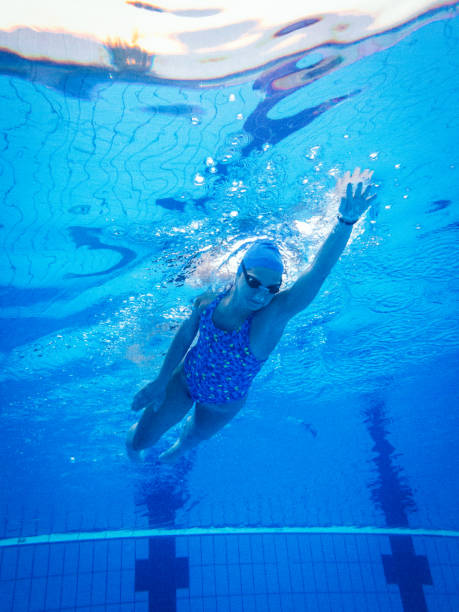 istock Professional swimmer freestyle swimming in pool 697383884