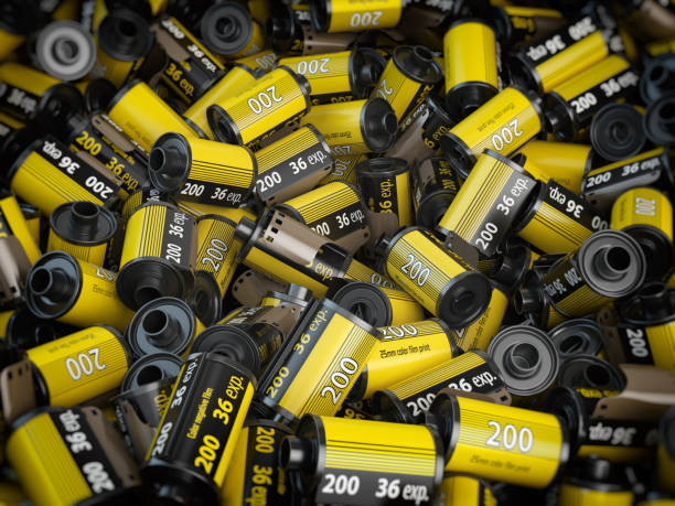 istock Old camera  photo film cassettes or rolls  background. 697389906