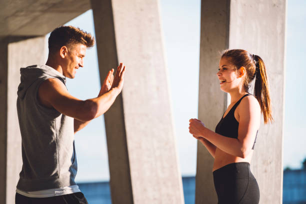 istock Happy athletes taking a break from exercising and having fun 697399760