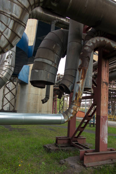 istock Old industrial technological installations with damaged pipelines 697400298