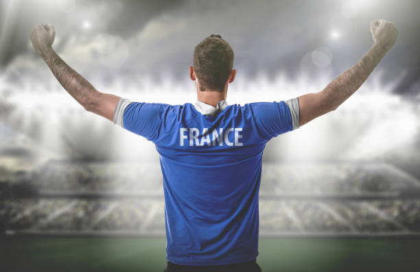 istock French Fan / Sport Player on uniform celebrating 697404434