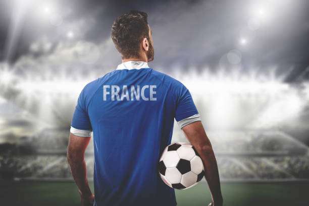 istock French Fan / Sport Player on uniform celebrating 697404484