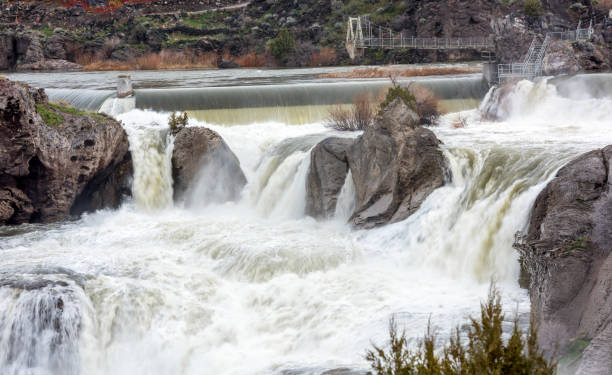 istock churning water at the top of a waterfall 697406992
