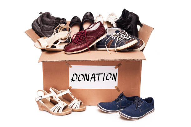 Donation box with shoes stock photo