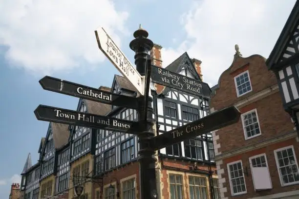 Chester, UK - May 25, 2017:guidepost stands on Eastgate Street and St Werburgh Street in Chester