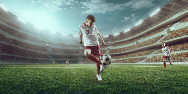 istock Soccer kids players in action 697427160