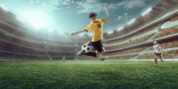 istock Soccer kids players in action 697427168