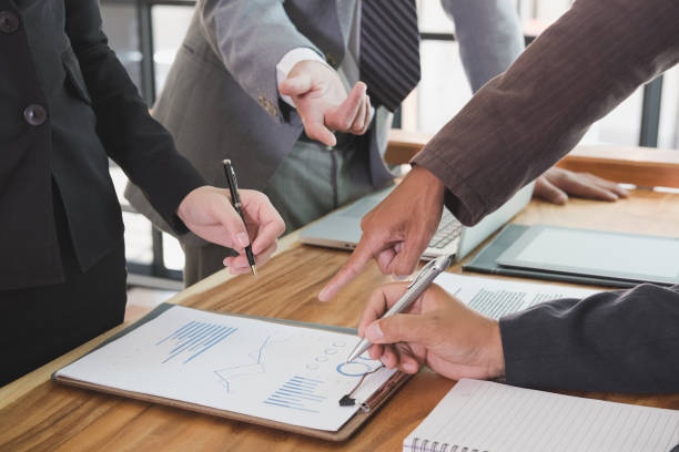 istock young business people and entrepreneur working around table in office. teamwork, collaboration, corporate concept. 697427536