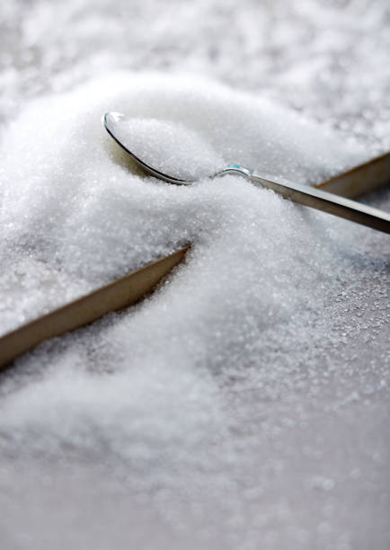 istock Closeup of sugar in the spoon 697438092