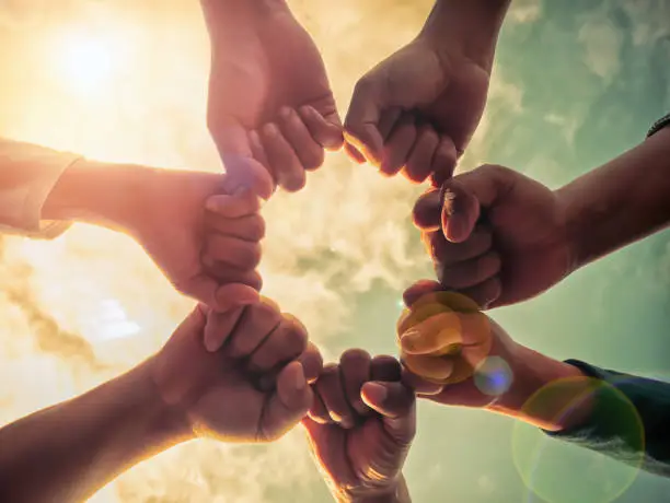 Photo of Business group with hands together, teamwork concepts