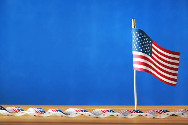 istock 4th of July decorations on blue background 697442392
