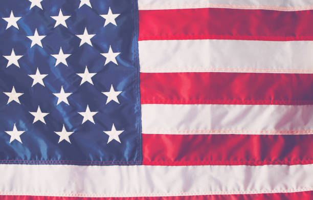 istock 4th of July decorations on American flag background 697442490