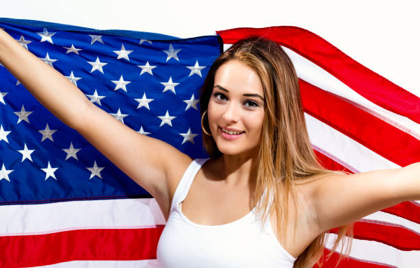 Young woman holding American flag
