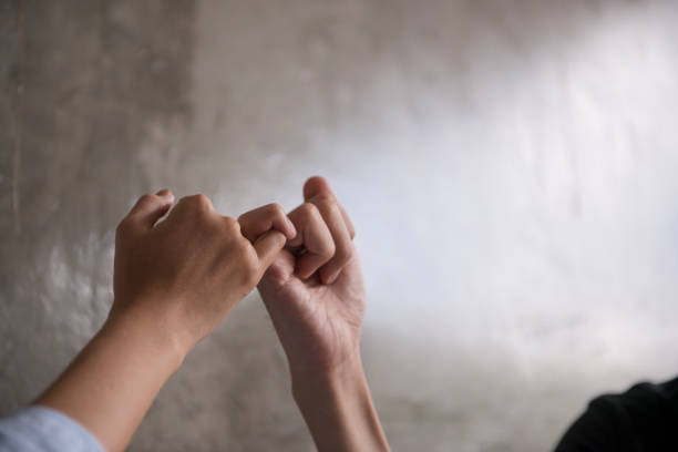 Hand to pinky swear, pinky promise hand signs. stock photo