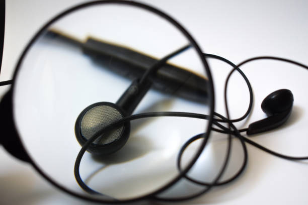 istock Black earphones on white background 697451870