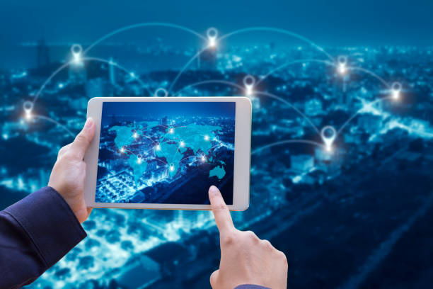 istock hand holding smart phone and cityscape with Map pin flat above network connection concept,technology concept 697459838